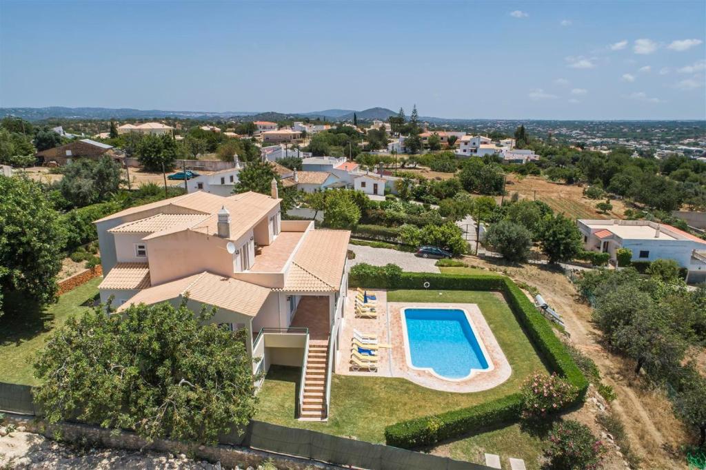 an aerial view of a house with a swimming pool at Casa Campo in Loulé
