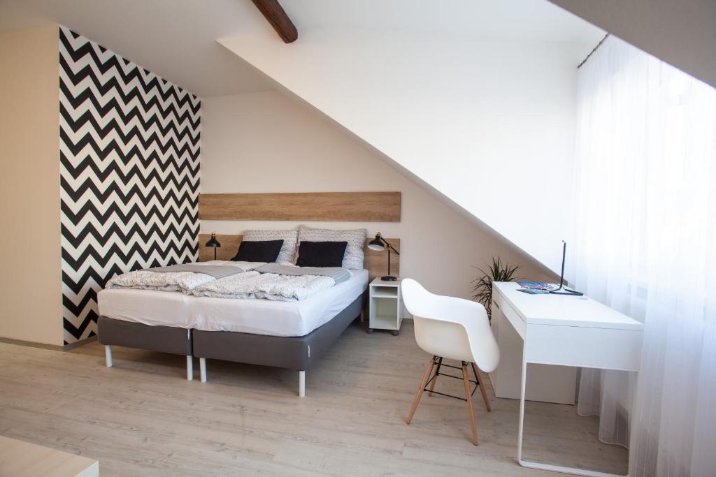 Postel nebo postele na pokoji v ubytování Haas Apartments