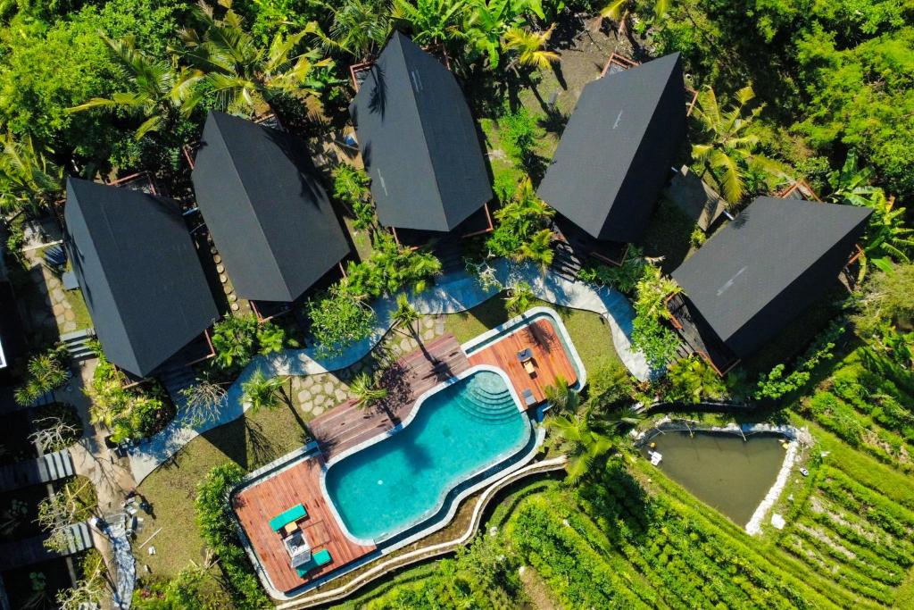 an aerial view of a resort with a swimming pool at Anandinii Resort Sidemen by AGATA in Sidemen