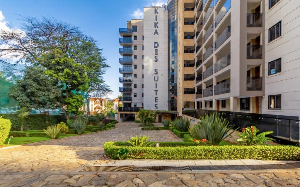 an apartment building with a garden in front of it at Kika Des Hotel Suites - Serviced Apartments, Westland, Nairobi in Nairobi