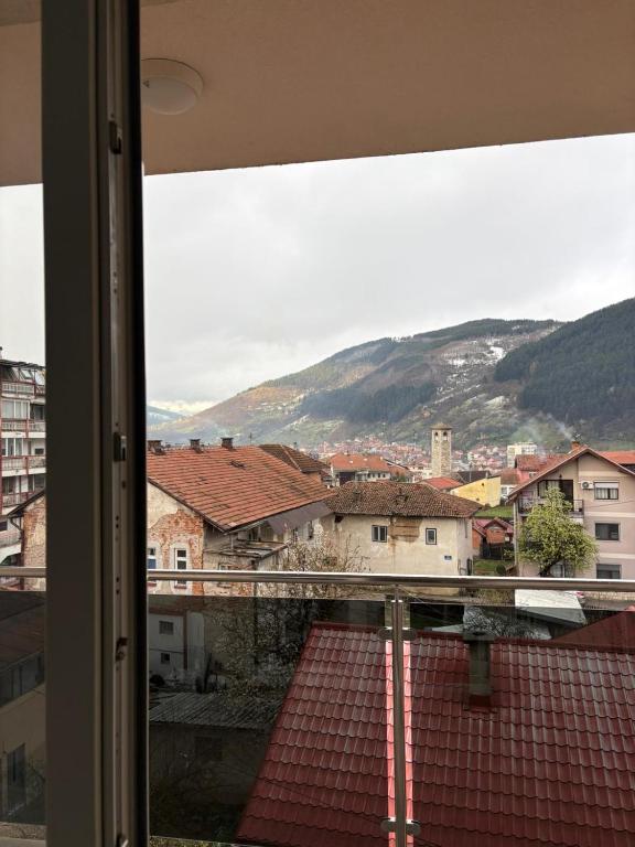 a view from a window of a town with a mountain at FocaLux in Foča