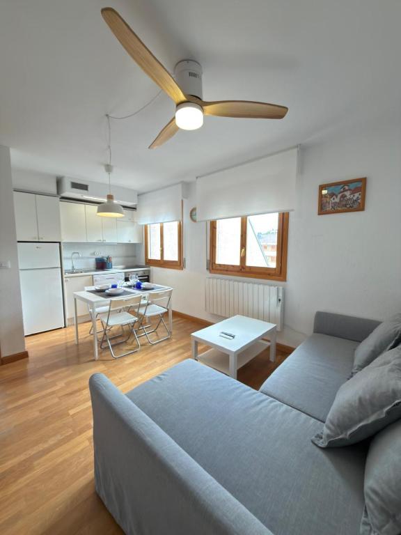 a living room with a couch and a table at Alameda in Jaca
