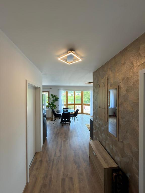 a living room with a table and a dining room at Main Panorama Suite 97896 Freudenberg in Freudenberg am Main