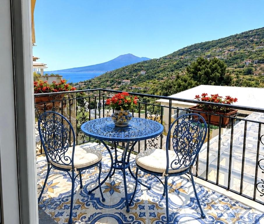 a table and chairs on a balcony with a view at B&B Venere Rooms in Pimonte