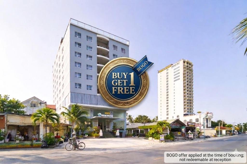 a building with a buy gift free sign in front of it at Palette Muine Boutique Hotel Near Mui Ne Beach in Mui Ne