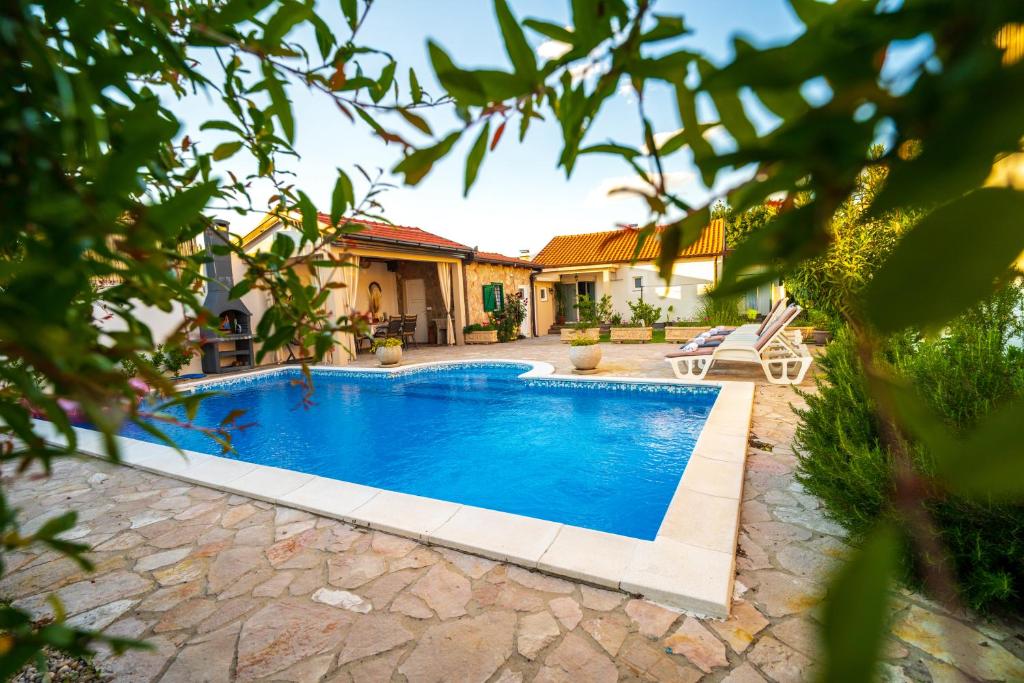 a swimming pool in the backyard of a house at Villa Bella in Mostar