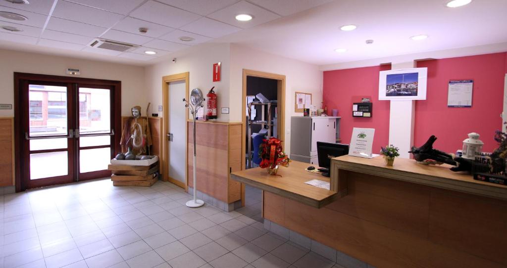 a lobby of a store with a counter and a refrigerator at Albergue Trinkete Etxea in Lekeitio