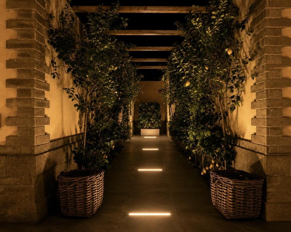 a corridor with potted plants in a building at Prince Residence in Castellammare di Stabia