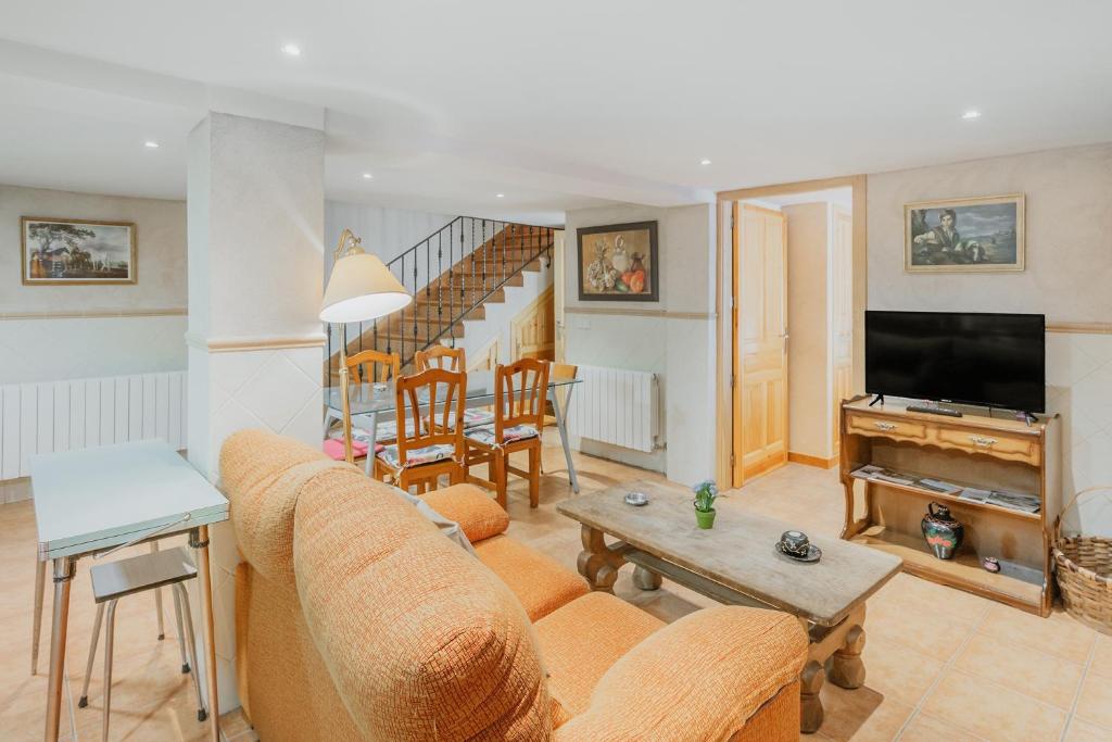 a living room with a couch and a table at Casa Romo 1 in Chavida