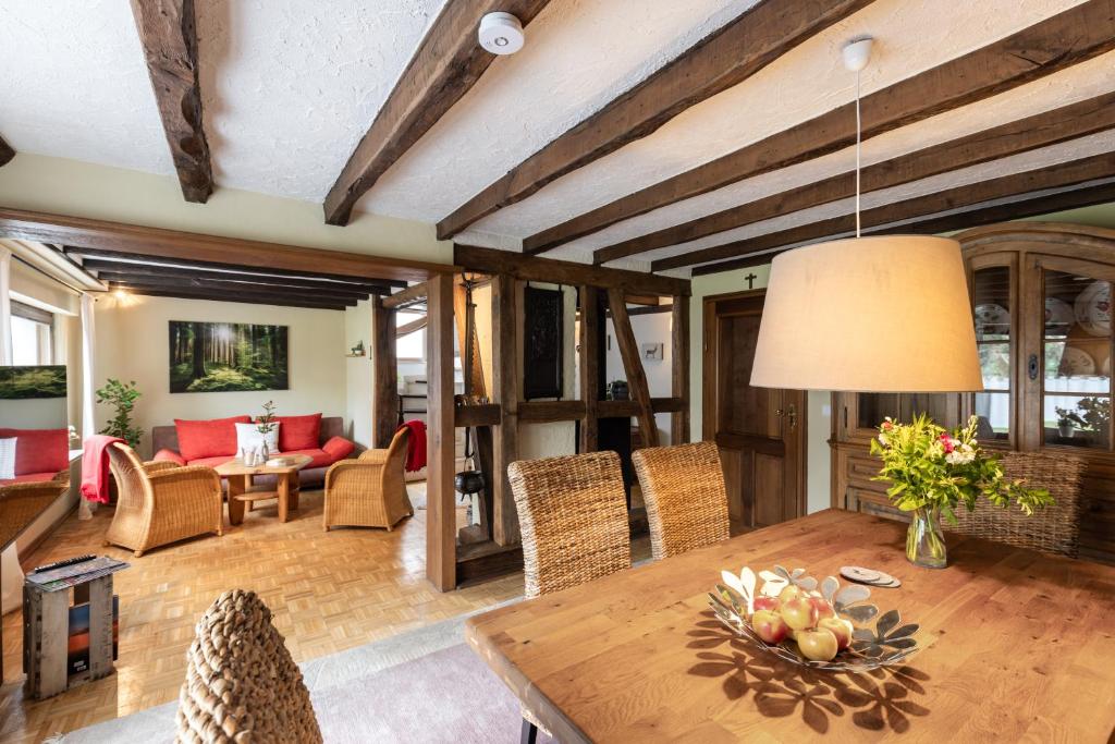 a living room with a table and chairs at Ferienhaus Rosa in Mechernich