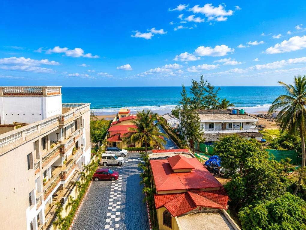 an aerial view of a building and the beach at Aryans Sea Sight Resort Mandarmani in Mandarmoni