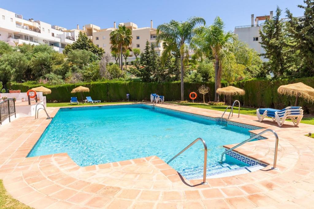 Bright Coastal Apartment with Pool and Parking