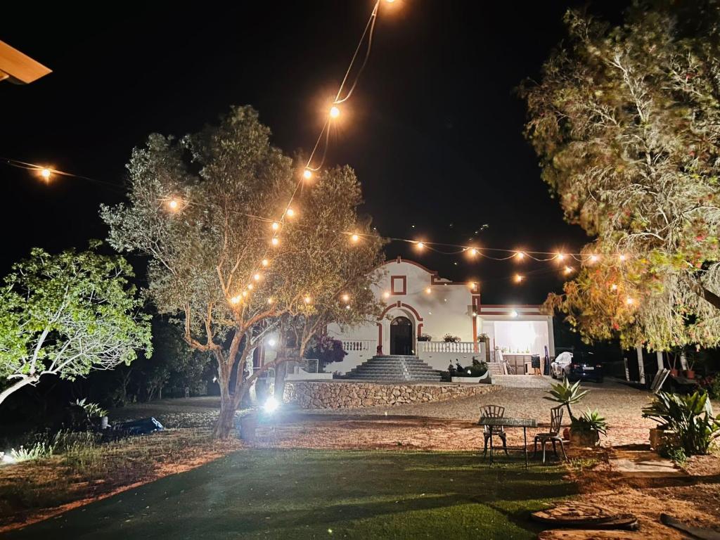 a house lit up at night with lights at Villa Madeira in Silves