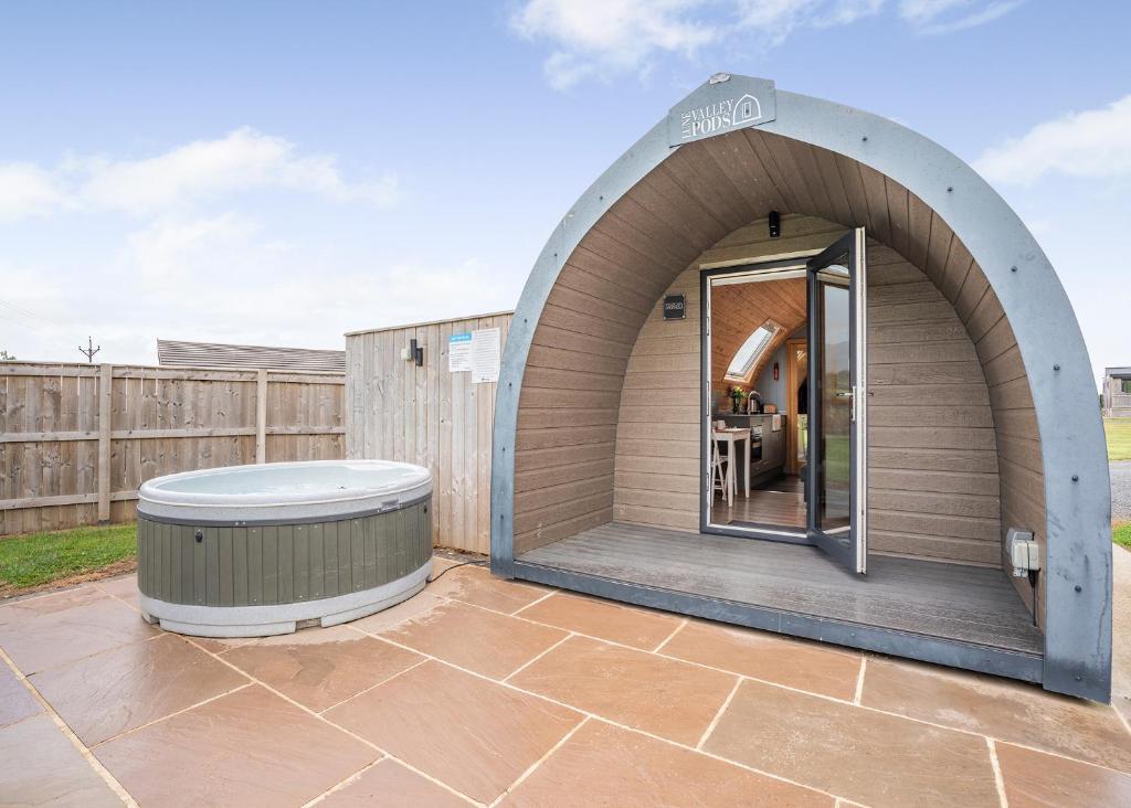 a circular building with a hot tub on a patio at South View Retreat in Carlton