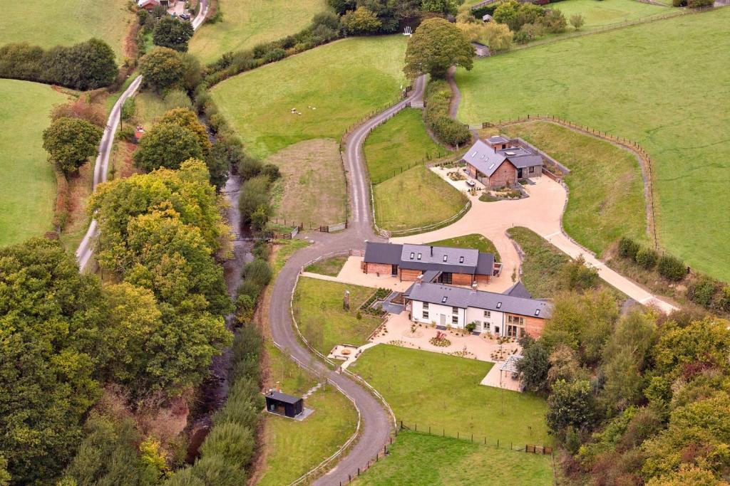 an aerial view of a large house on a hill at Haymill Retreat in Trefeglwys