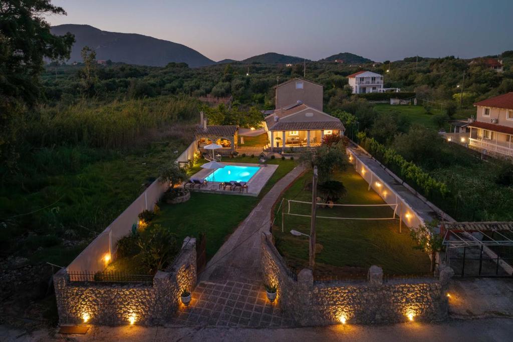 an aerial view of a house with a swimming pool at Pavlos & Sofia Harmony Villa with Private Pool in Corfu