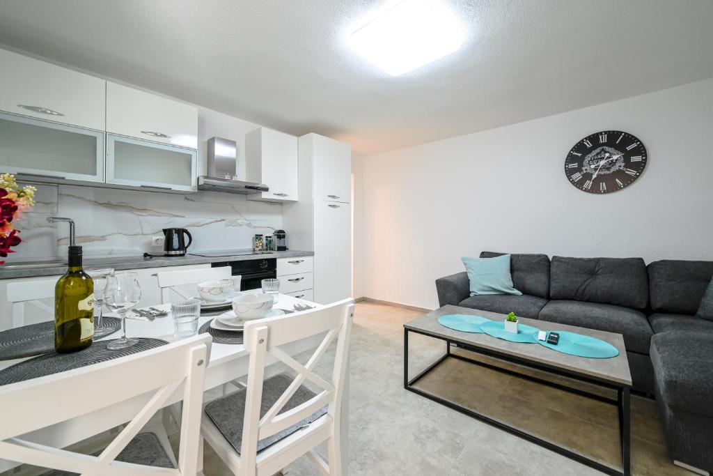 a living room with a couch and a table at Gasparevic Apartments in Rovinj