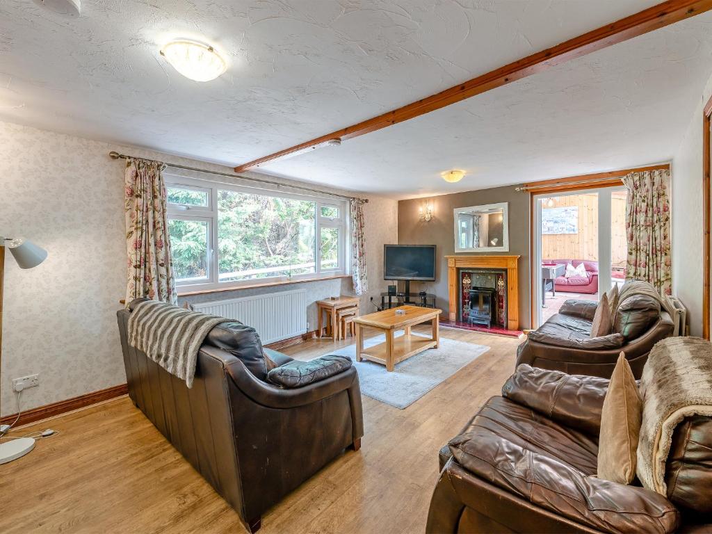 a living room with two chairs and a couch at Captains Quarters - 16266 in Staithes