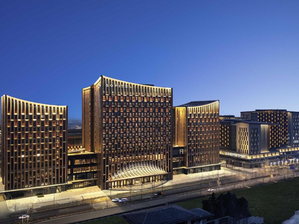 a group of tall buildings in a city at Sofitel Xiong An in Baoding