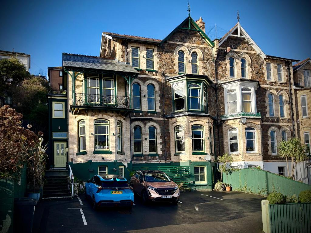 a large building with cars parked in front of it at The Earlsdale Bed and Breakfast in Ilfracombe