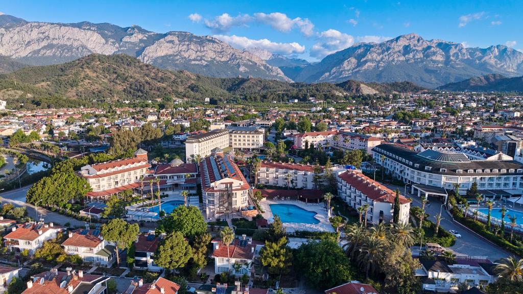 an aerial view of a city with mountains in the background at Fun Sun Smart Lurea Beach in Kemer