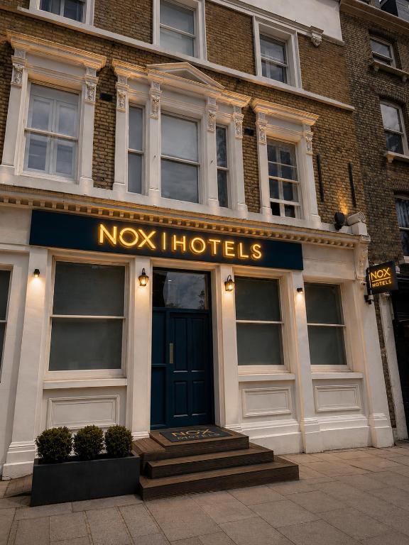 a noks hotels sign on the front of a building at NOX Belsize Park in London