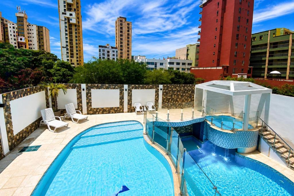 a swimming pool on the roof of a building at Vadamar Hotel Collection Rodadero in Gaira