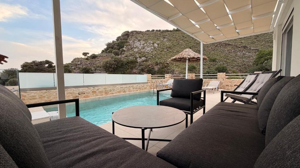 a view of a swimming pool from a house at Villa Casa Solea in Myrthios