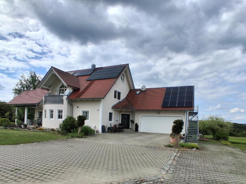 a house with solar panels on the roof at Ferienwohnung Elisabeth in Riedenburg