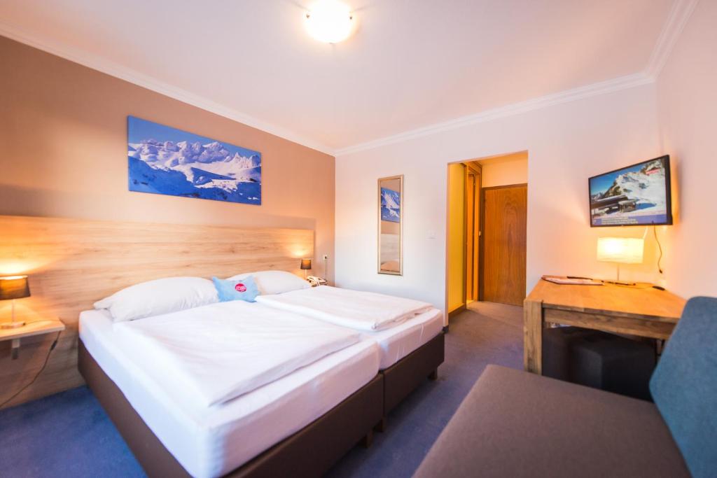 Posteľ alebo postele v izbe v ubytovaní Hotel Mosermandl