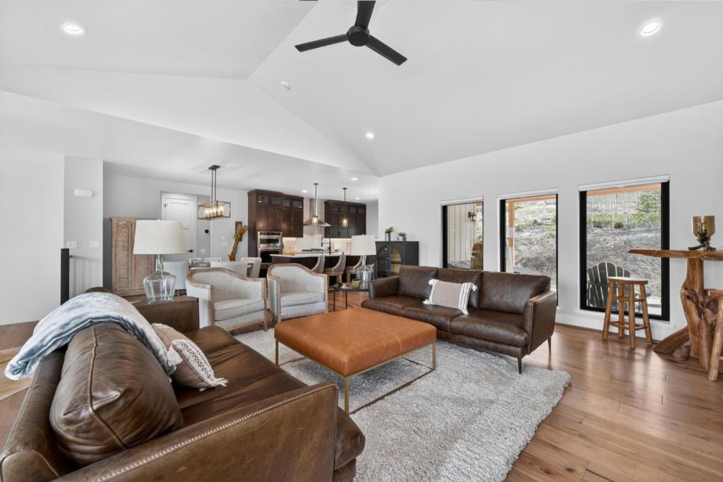 a living room with a couch and a table at 238 Night Hawk Home in Granby