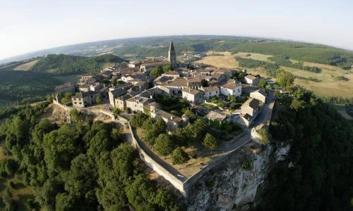 a small town on top of a mountain at Chez Julia in Puycelci
