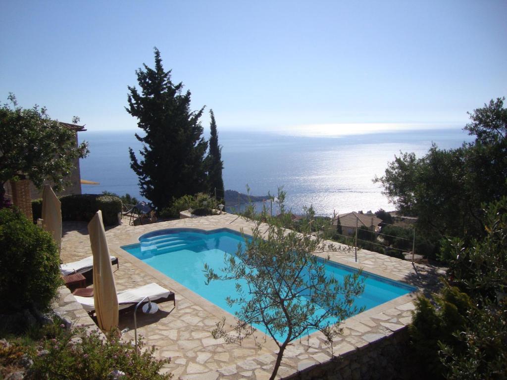 a swimming pool with a view of the ocean at Villa koukla horizon in Agios Nikolaos