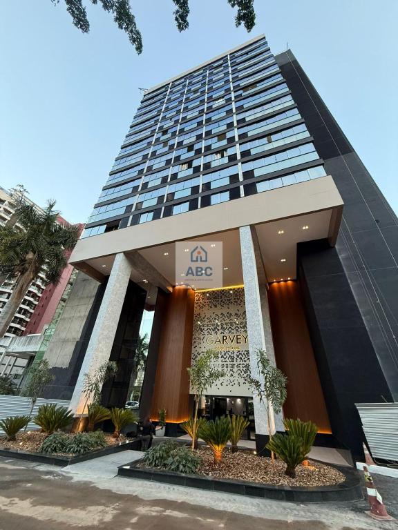 a tall building with a ac logo on it at ABC Apart Hotel in Brasília