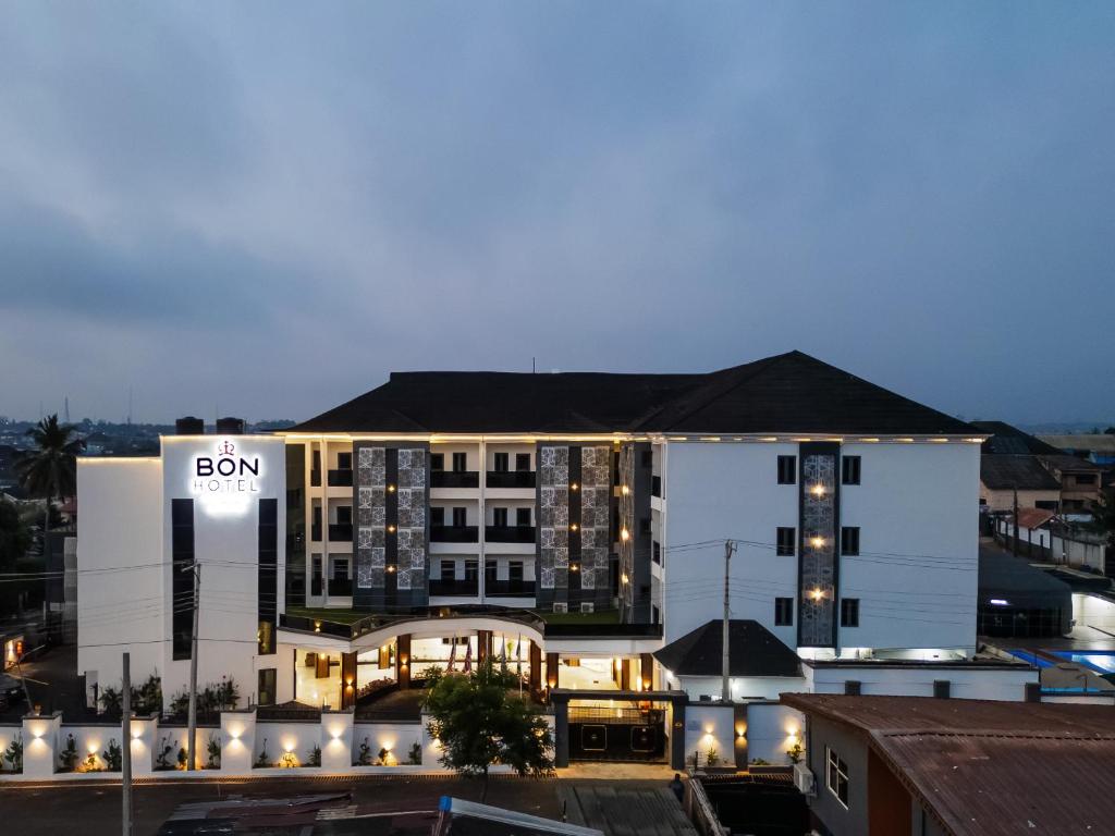 a building with a sign on the side of it at BON Hotel Kabuwol in Ibadan