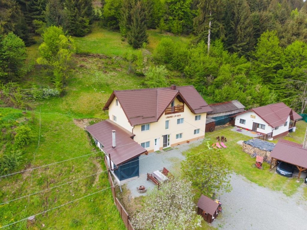 an aerial view of a house in a field at Cabana La Cucu in Vadu Moţilor
