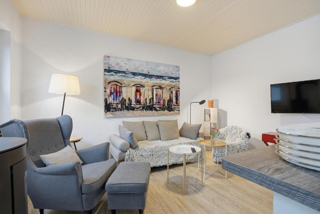 a living room with a couch and a table at Kiek In in Greetsiel