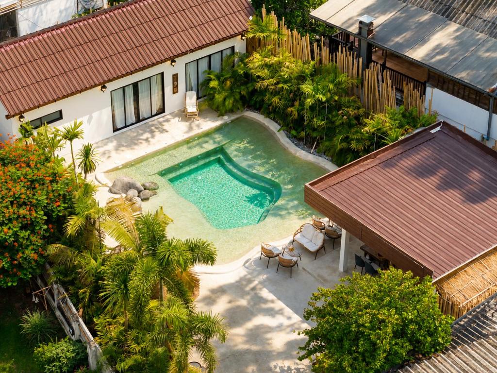 an overhead view of a swimming pool in a house at Palmcove Chiang Mai Old Town in Chiang Mai