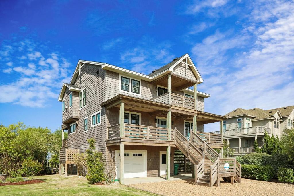 a large house with a staircase in front of it at Sanctuary in Duck