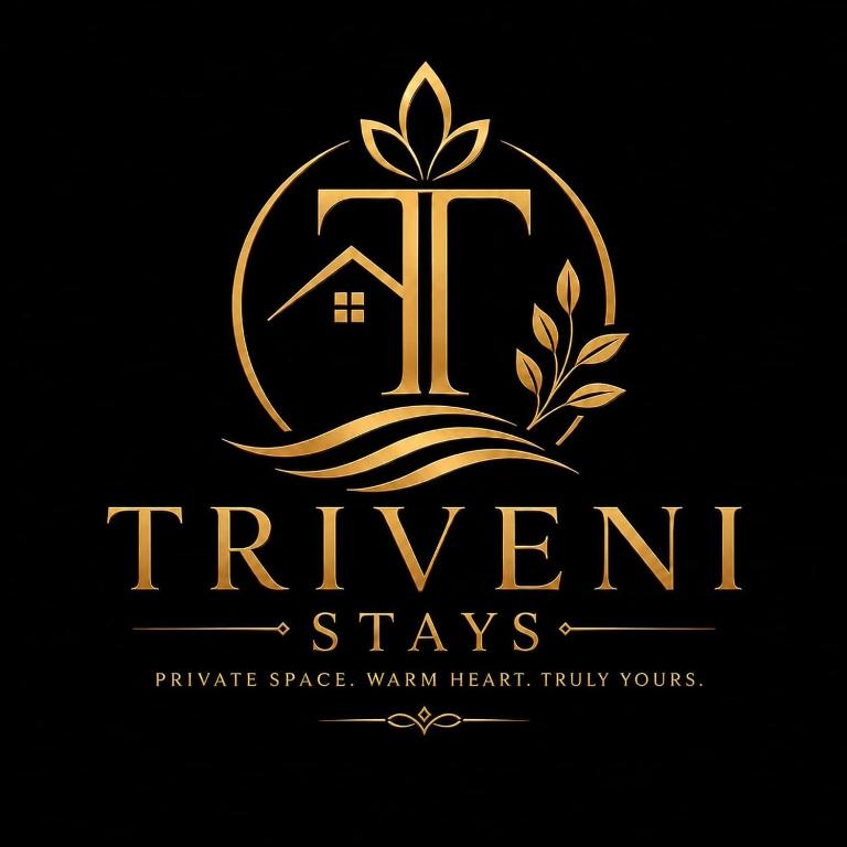 a gold logo with a house in the middle at Triveni Stays in Jorhat