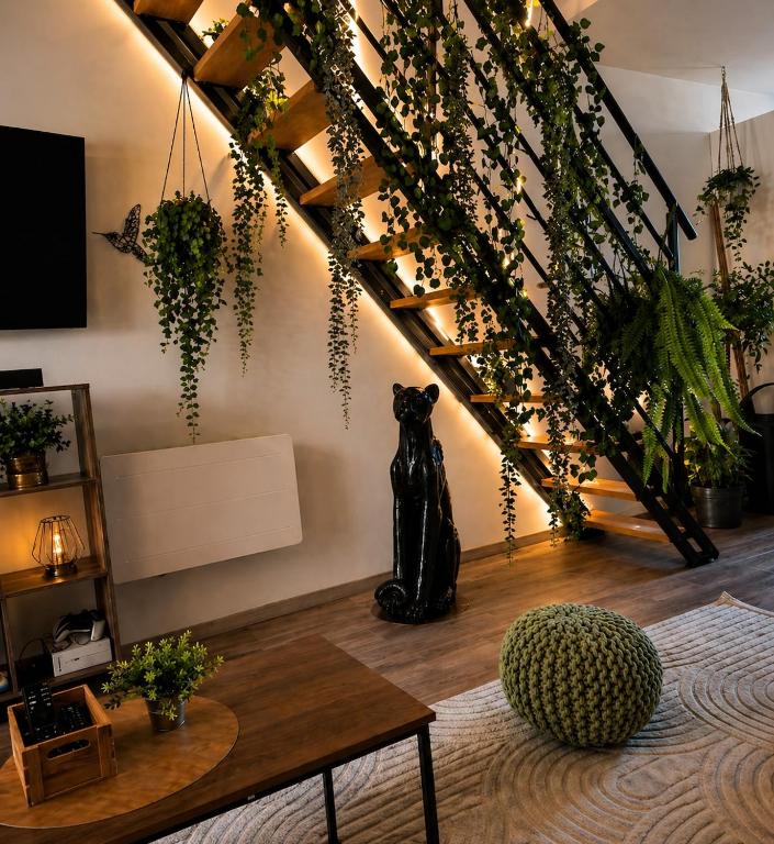 a living room with a black bear sitting under a staircase at Urban Jungle Experience Hyper Centre Gare in Épinal
