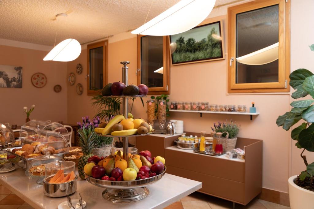 a buffet with fruits and vegetables on a table at Marin Hotel in Pula