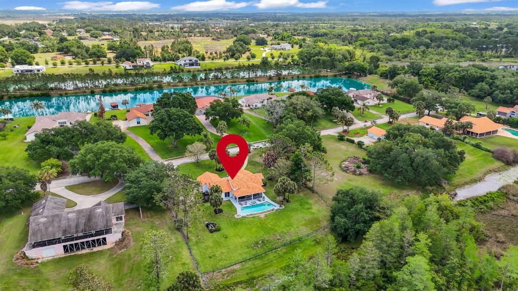 an aerial view of a home with a red marker at SWISS 101 - Lake Olsen in Clermont
