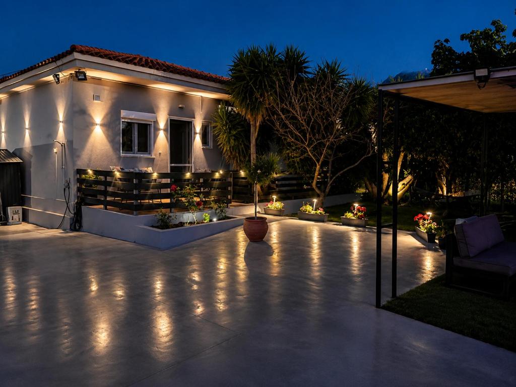 a house with a patio at night with lights at Casa Miniera in Linopótis