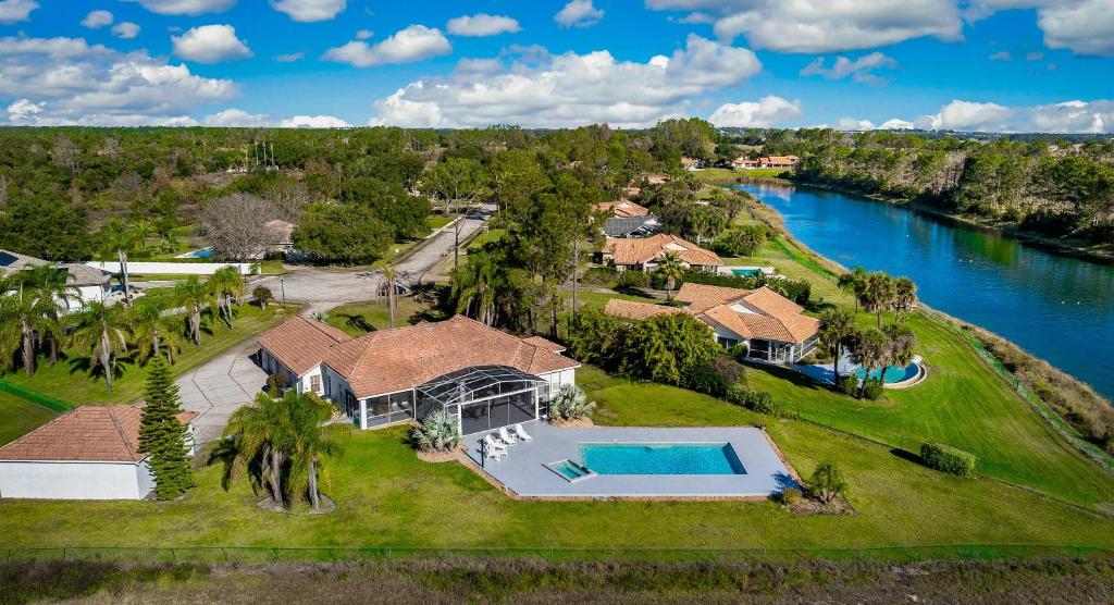 an aerial view of a house with a swimming pool at SWISS 56 - Lake Denise in Clermont