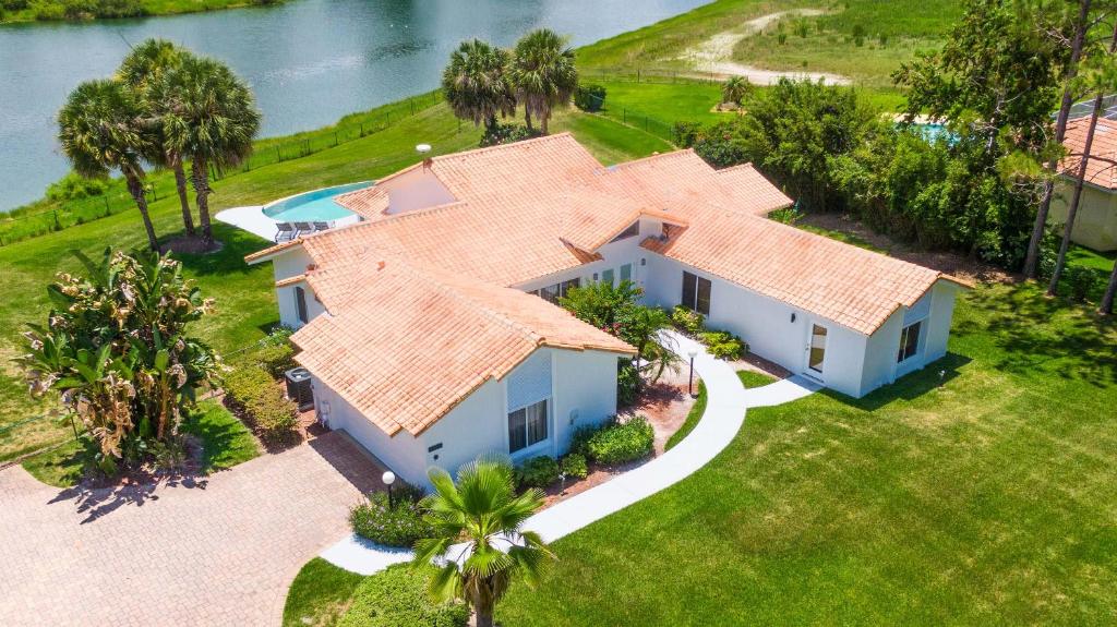 an aerial view of a house with a house at SWISS 57 - Lake Denise in Clermont