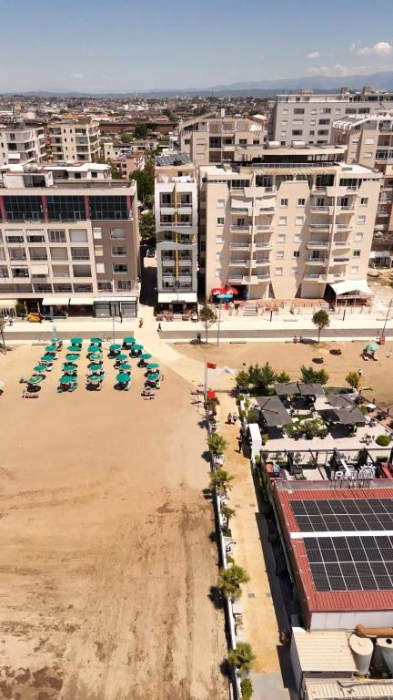 an aerial view of a beach with chairs and buildings at SeaView Vacation Rooms in Durrës