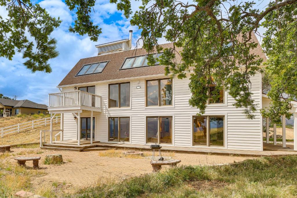 a large white house with large windows at Hiking, Wineries & More! Mtn-View Gem in Tehachapi in Tehachapi