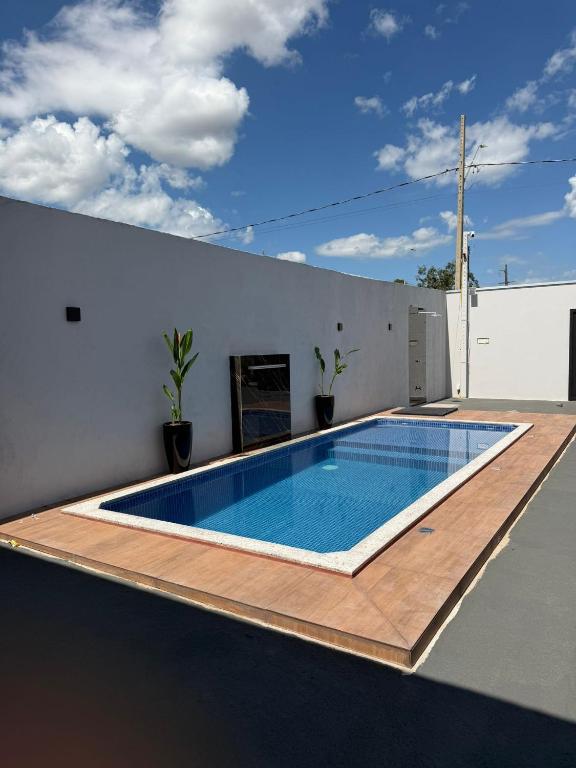 a swimming pool on the roof of a house at Lotus in Gurupi