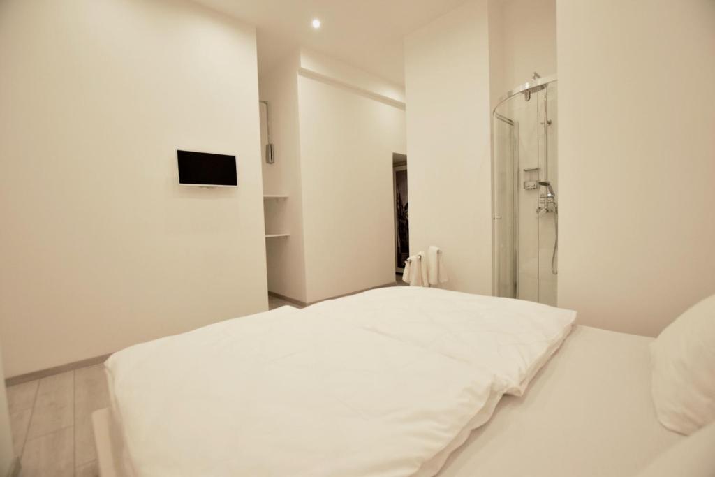 Postel nebo postele na pokoji v ubytování Binder-Home Stylish Studios Budapest/Parliament